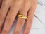 Radiant Horizon Wedding Band in 14k gold featuring a classic fit on a finger