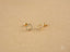 Two gold heart drop earrings from Radiant Love, crafted in 18k gold with CZ accents