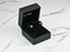 Pink gemstone stud earrings in a black jewelry box, Radiant Ruby Sparkle design
