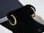 Gold hoop earrings with inset diamonds set in 18k yellow gold for elegant style