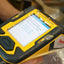 Rugged yellow handheld device showing numerical data for Art Gold jewelry repair