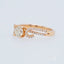 Romantic 18k rose gold diamond ring with 0.5 ct diamond centerpiece, crafted for elegance and modern style.