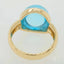 Cabochon Blue Topaz ring in 18k gold setting, showcasing a 17.8 Ct blue topaz with a smooth dome-like cut.