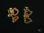 Gold heart-shaped stud earrings with cubic zirconia stones in Art Gold jewelry design