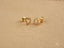 Gold heart-shaped stud earrings featuring 18k gold and sparkling cubic zirconia stones