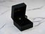Heart-shaped 18k Gold earrings with cubic zirconia stones in a chic black jewelry box