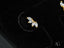 Gold and crystal leaf-shaped Starlight Trio earrings, featuring gold CZ marquise studs