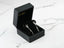 Silver earrings in a black jewelry box for Stellar Bloom 18k White Gold Diamond Earrings