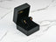 Gold and ruby earrings in a black jewelry box showcasing 18k Gold Citrine and Rubellite Earrings