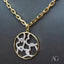 Symphony of Love white gold hearts pendant in 18k yellow and white gold, showcasing interlocking hearts design from Art Gold Jewelry.