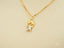18k Gold Timeless Charm Pendant with a dress-like figure charm necklace