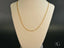 Gold Figaro chain necklace from Timeless Sophistication in solid 18K gold