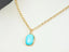Gold-chained necklace featuring a Turquoise gemstone pendant from Turquoise Bloom collection