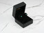 Emerald stud earrings in a black jewelry box for Verdant Sparkle 18k Gold Green CZ
