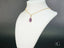 Purple teardrop crystal pendant on 18k gold chain, perfect for the Violet Bloom Pendant