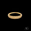 Gold ring with white cubic zirconias in a curved band of 18k gold
