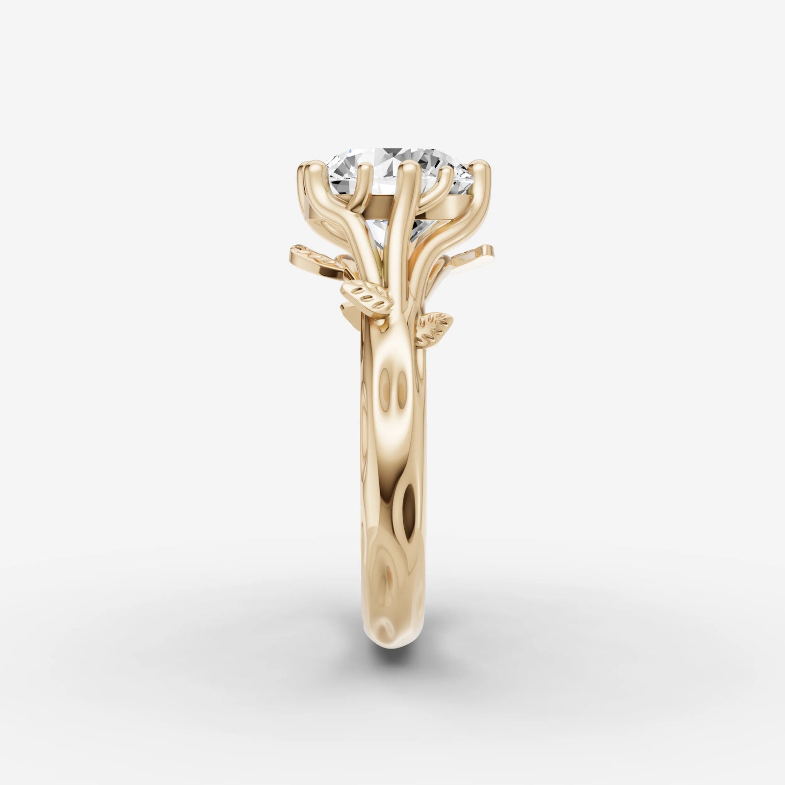 Fleur round diamond setting in gold, angled view
