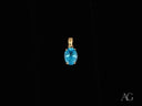 Azure Gleam blue topaz pendant in 14k gold with oval-cut gem