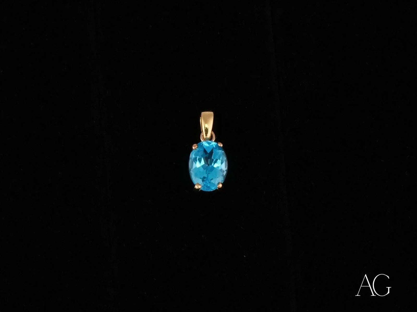 Azure Gleam blue topaz pendant in 14k gold with oval-cut gem
