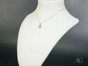 Azure Gleam blue topaz pendant in art gold jewelry