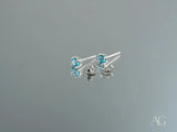 Azure Glow 18k white gold blue topaz stud earrings with butterfly backs