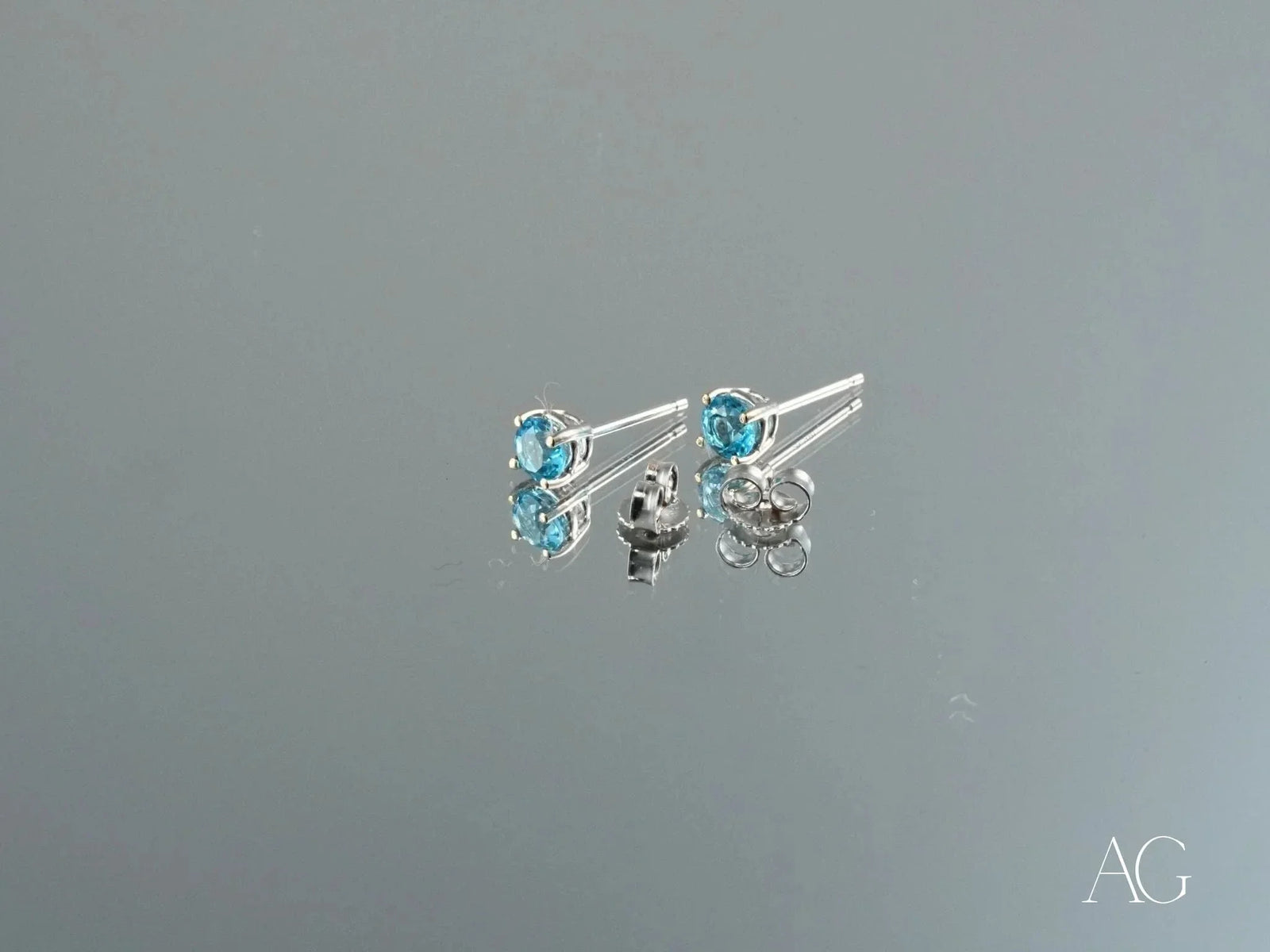 Azure Glow 18k white gold blue topaz stud earrings with butterfly backs