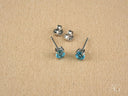 Two pairs of 18k white gold blue topaz stud earrings