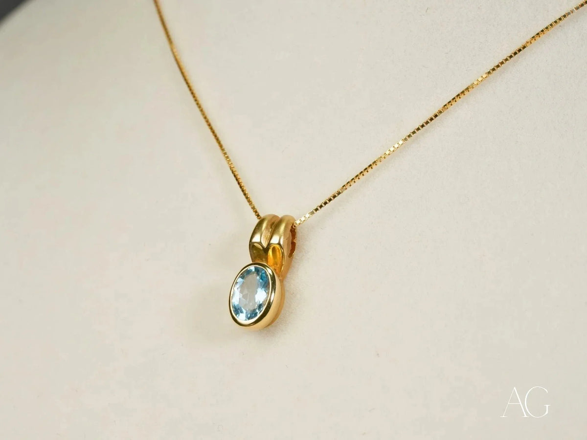 Azure Spark blue topaz pendant in art gold jewelry