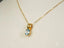 Gold box chain necklace with Azure Spark blue topaz pendant, an art gold jewelry piece
