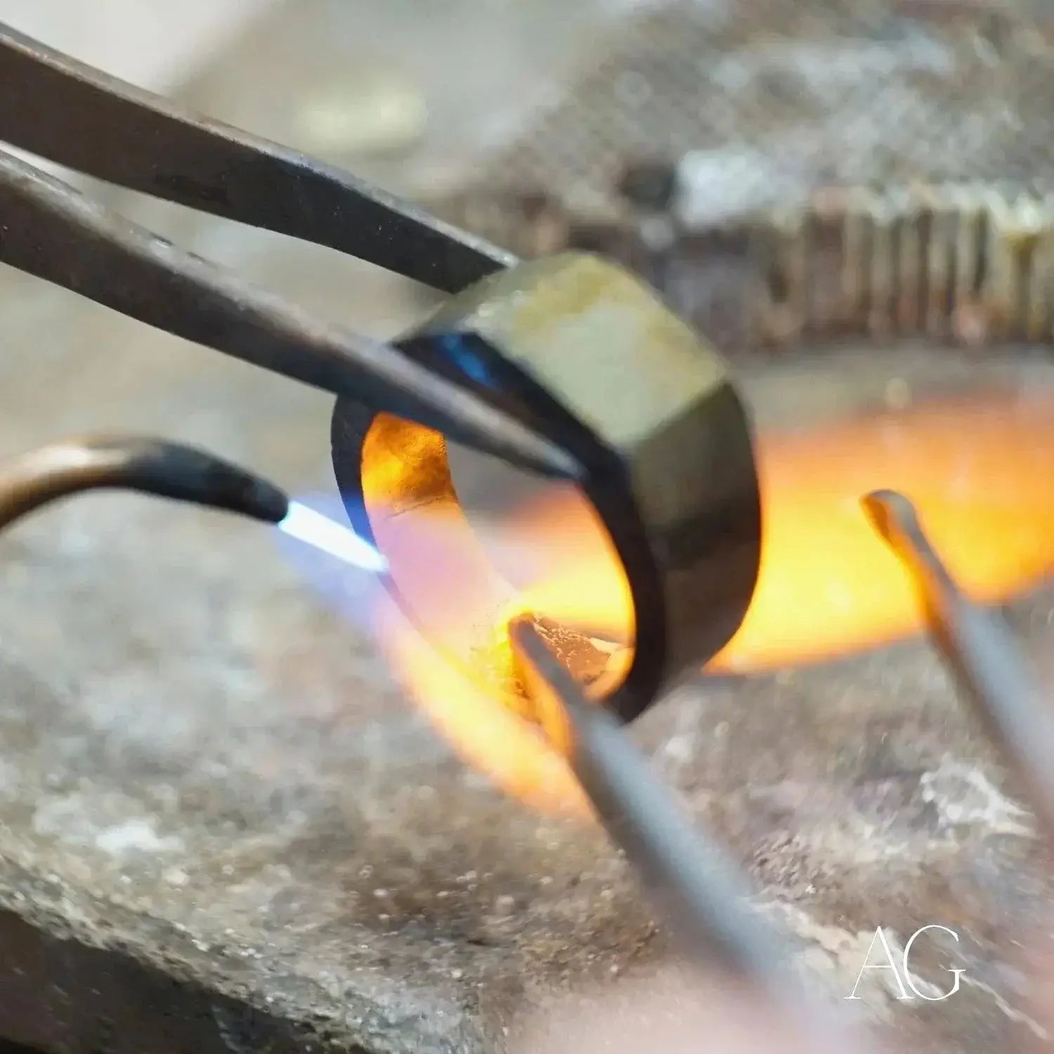 Torch heating blackened metal ring for stunning 18k gold rings