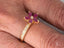 Gold ruby flower ring with marquise-cut rubies and diamond accents in Blooming Elegance style