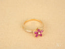Blooming Elegance 18k gold ruby flower ring with diamond cluster
