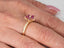 Gold ruby flower ring with marquise-cut rubies and pavé diamonds in blooming elegance design