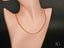 Elegant art gold jewelry showcasing a bold 18K gold chain necklace on a mannequin