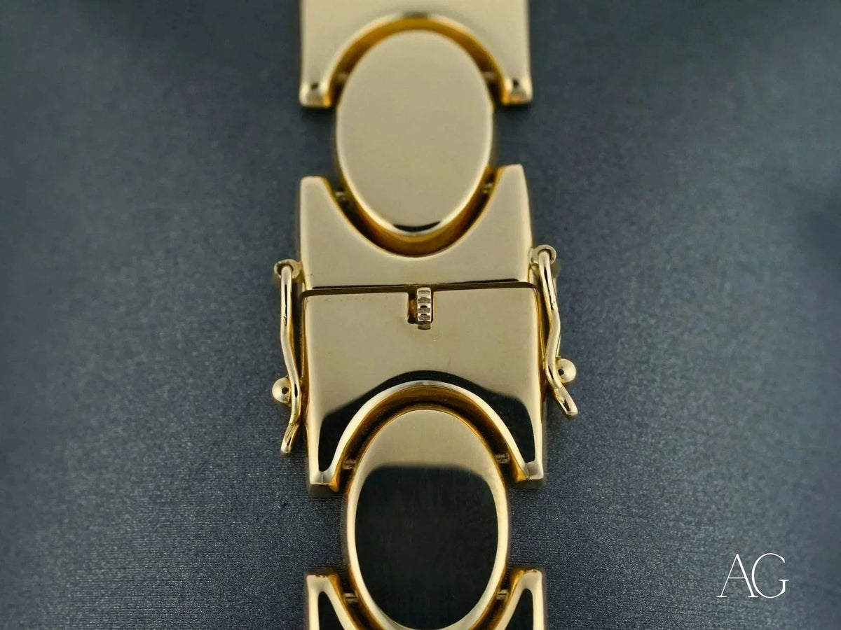 Bold men’s 18k solid gold bracelet with unique oval link pattern and box clasp