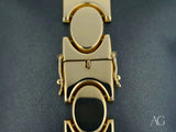 Bold men’s 18k solid gold bracelet with unique oval link pattern and box clasp