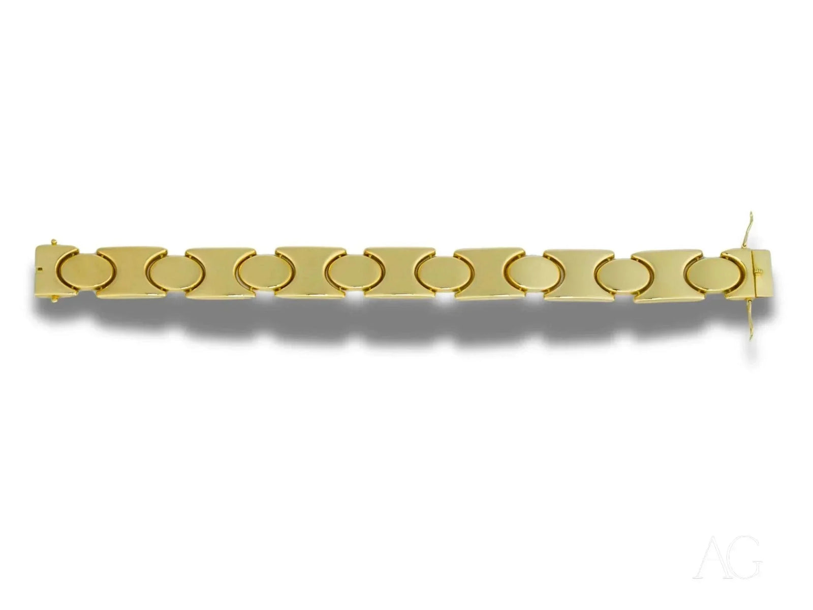 Bold men’s solid 18k gold bracelet with unique link pattern and hidden box clasp