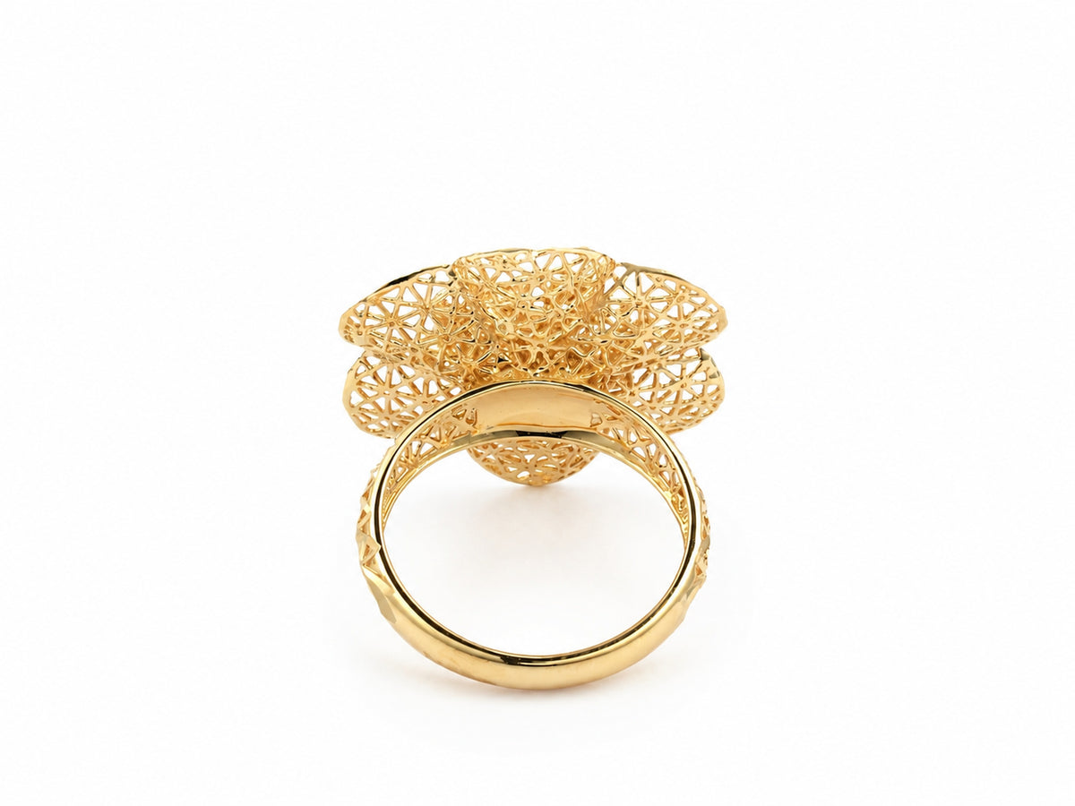 Underside view of 18K gold flower ring showing interior band and base of openwork floral setting