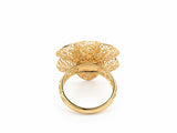 Underside view of 18K gold flower ring showing interior band and base of openwork floral setting
