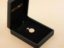 Celestia gold oval disc personalized initial pendant in black velvet box