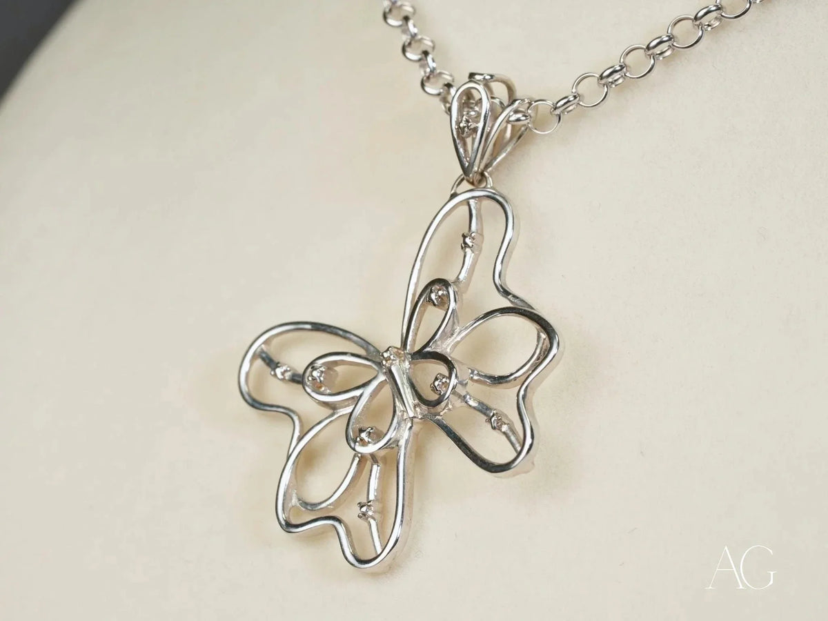 Celestial Flutter 18k white gold butterfly pendant with diamond accents