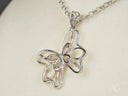 Celestial Flutter 18k white gold butterfly pendant with diamond accents