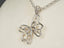 Silver butterfly pendant with small diamond accents in 18k white gold from Celestial Flutter art gold jewelry