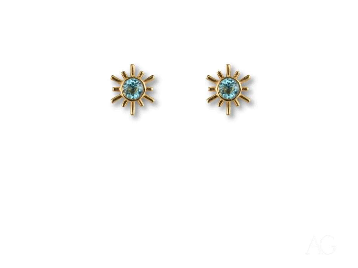 Celestial Glow gold blue topaz stud earrings with sunburst design