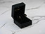 Black velvet jewelry box displaying Celestial Glow 18k Gold Star Earrings with beaded crescent