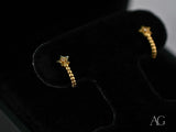 Celestial Glow 18k gold star earrings with clear gemstone charms