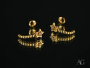Celestial Glow 18k gold star earrings with clear gemstones