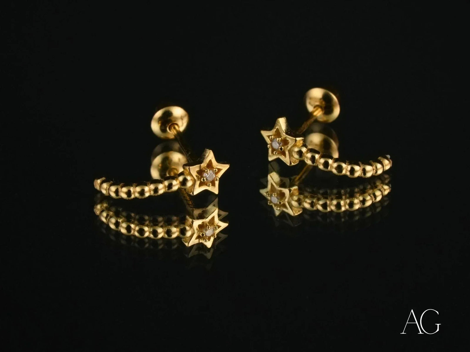 Celestial Glow 18k gold star earrings with clear gemstones