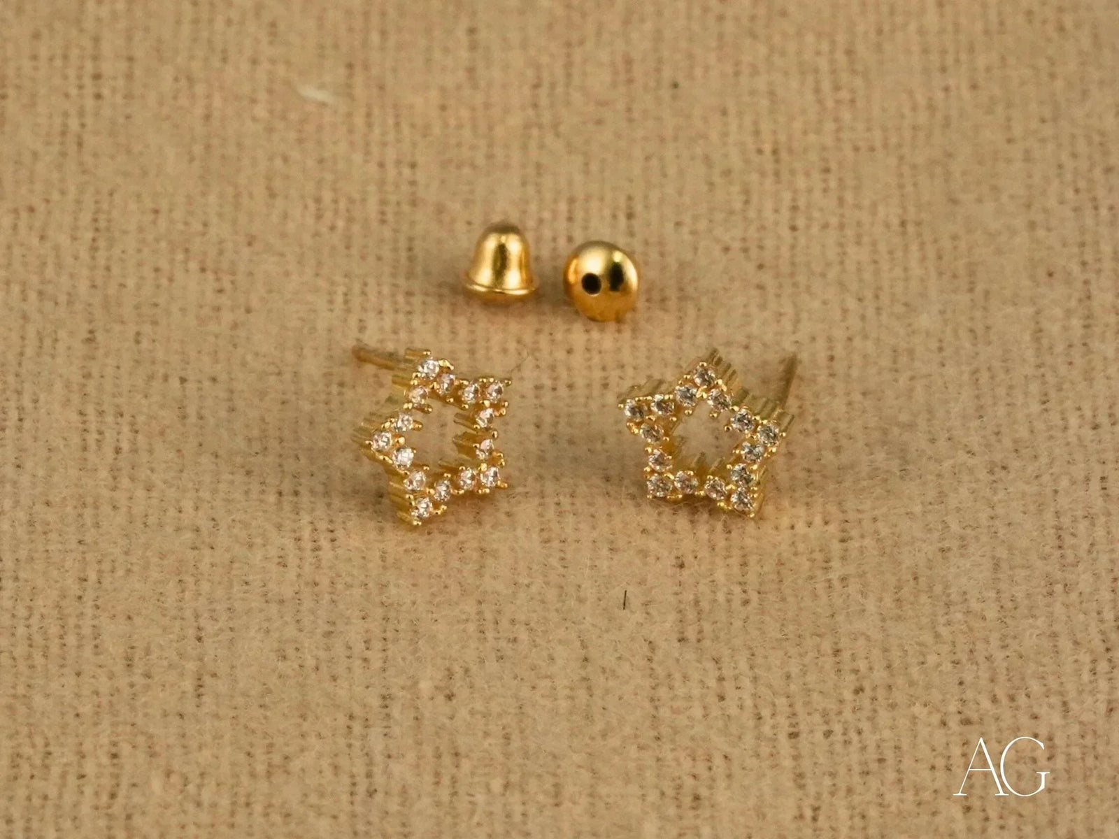 Dazzling 18k yellow gold CZ star stud earrings with gem accents