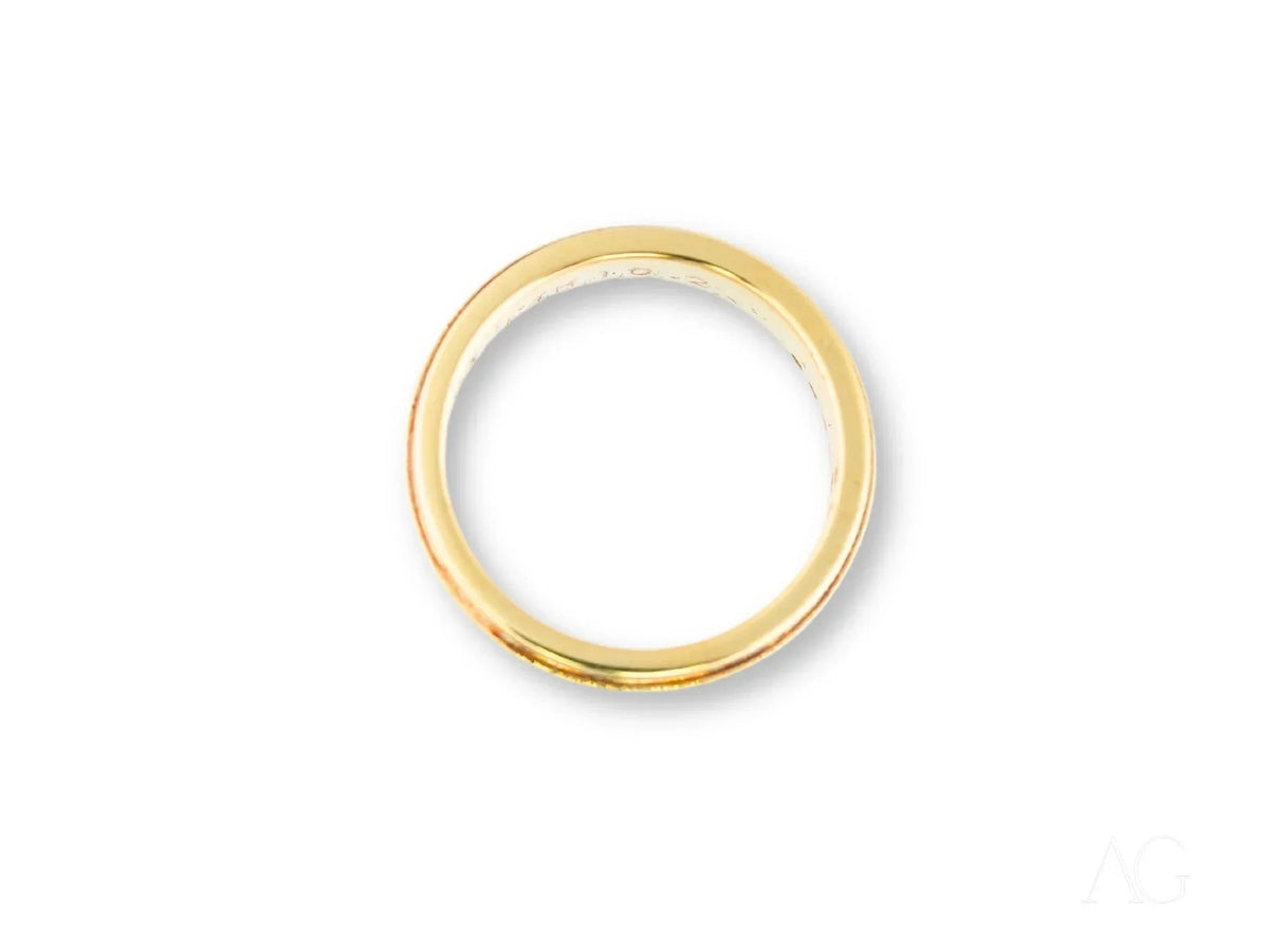 Two-tone gold wedding band, top-down view showing circular interior